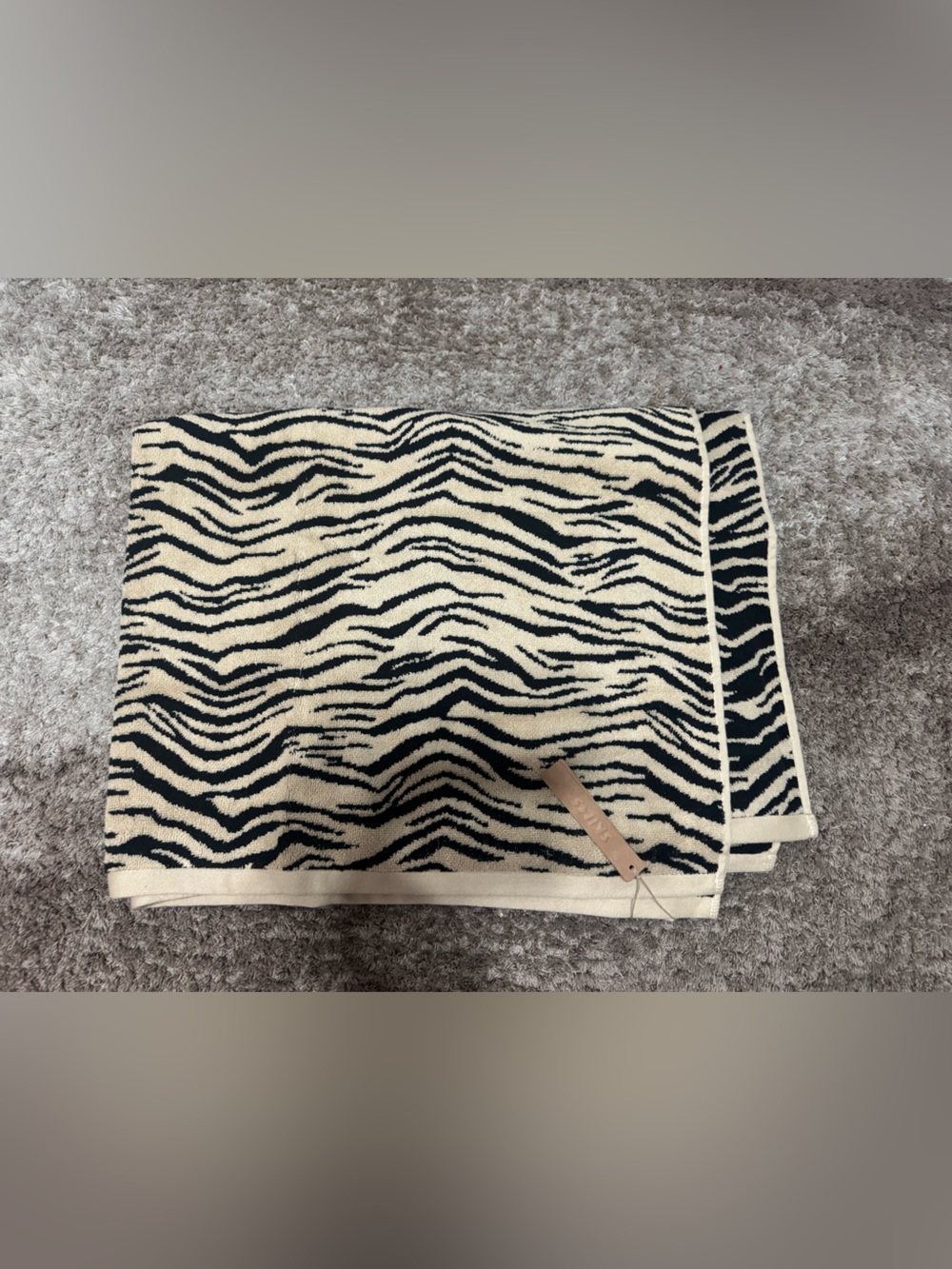 Skims recycled swim towel